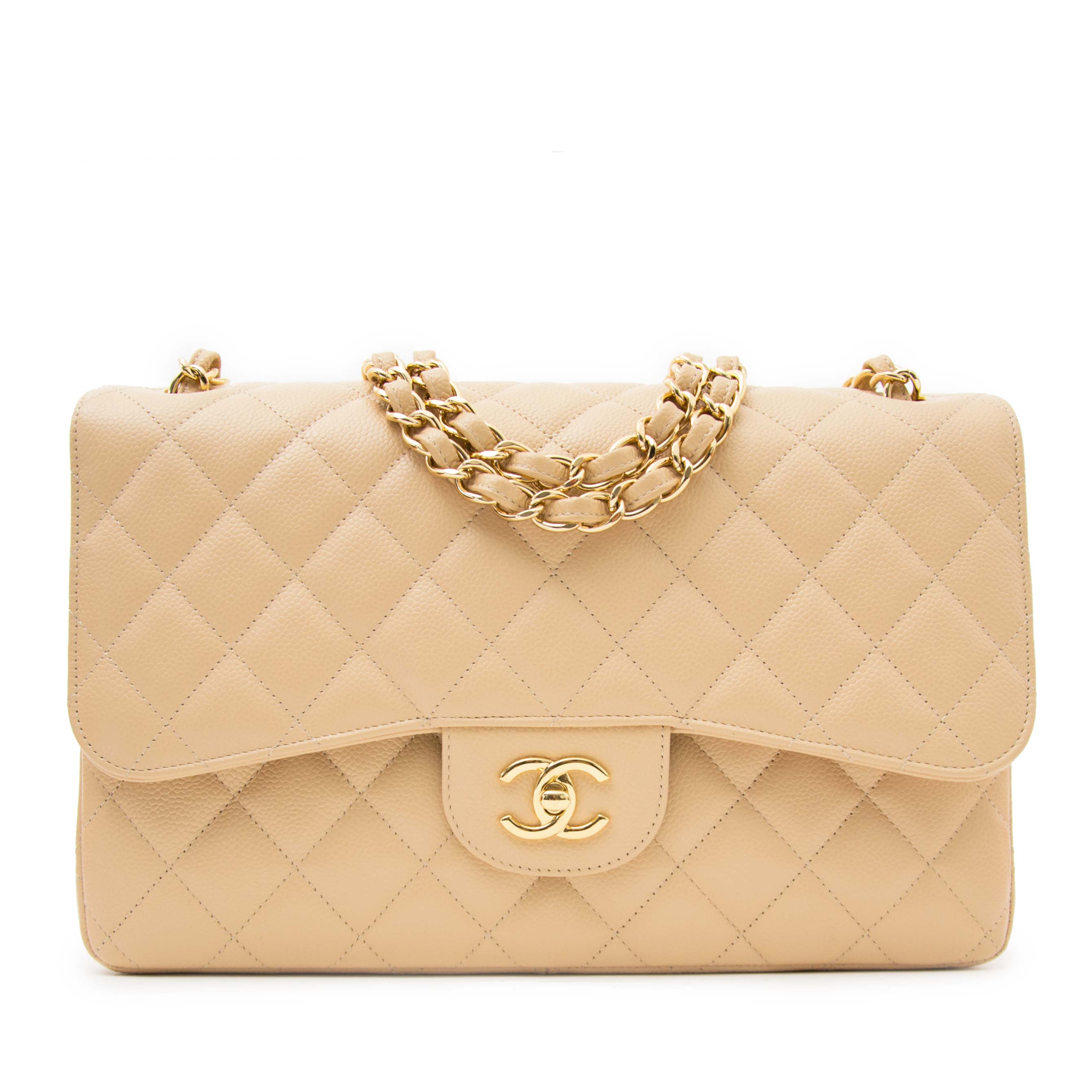 Votre Luxe - Chanel Nude Jumbo Classic Flap Bag ($8550)​​​​​​​​ ​​​​​​​​  This elegant Chanel jumbo bag is in nude caviar leather with gold-tone  metal hardware. In excellent 