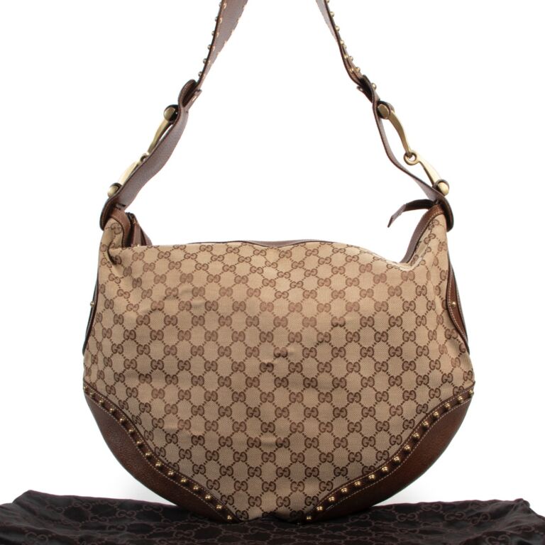 At Auction: GUCCI MONOGRAMMED TALL HOBO SHOULDER BAG