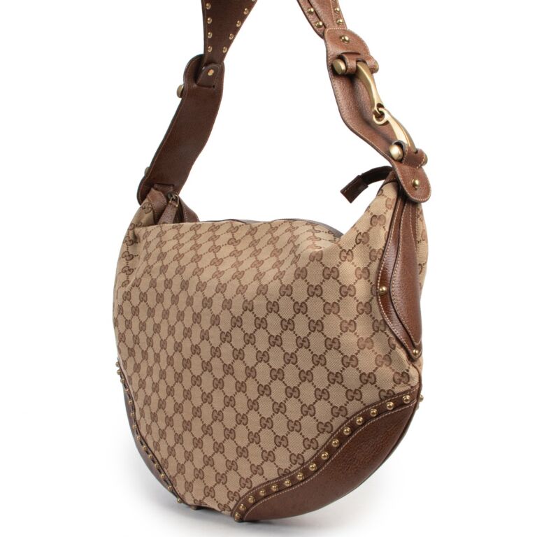 At Auction: GUCCI MONOGRAMMED TALL HOBO SHOULDER BAG