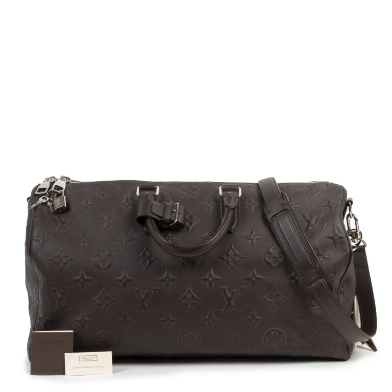 Louis Vuitton Monogram Revelation Bag