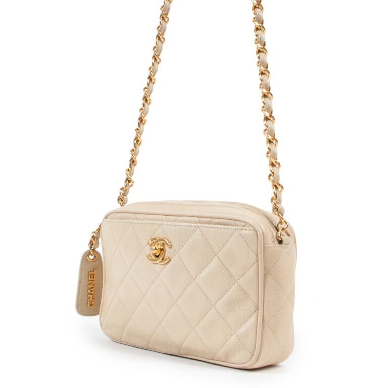 Sold at Auction: Chanel Gold Turnlock Camera Bag