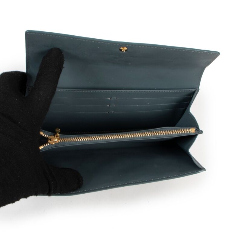 Louis Vuitton, a black embossed leather 'Sarah' wallet, 2015. - Bukowskis