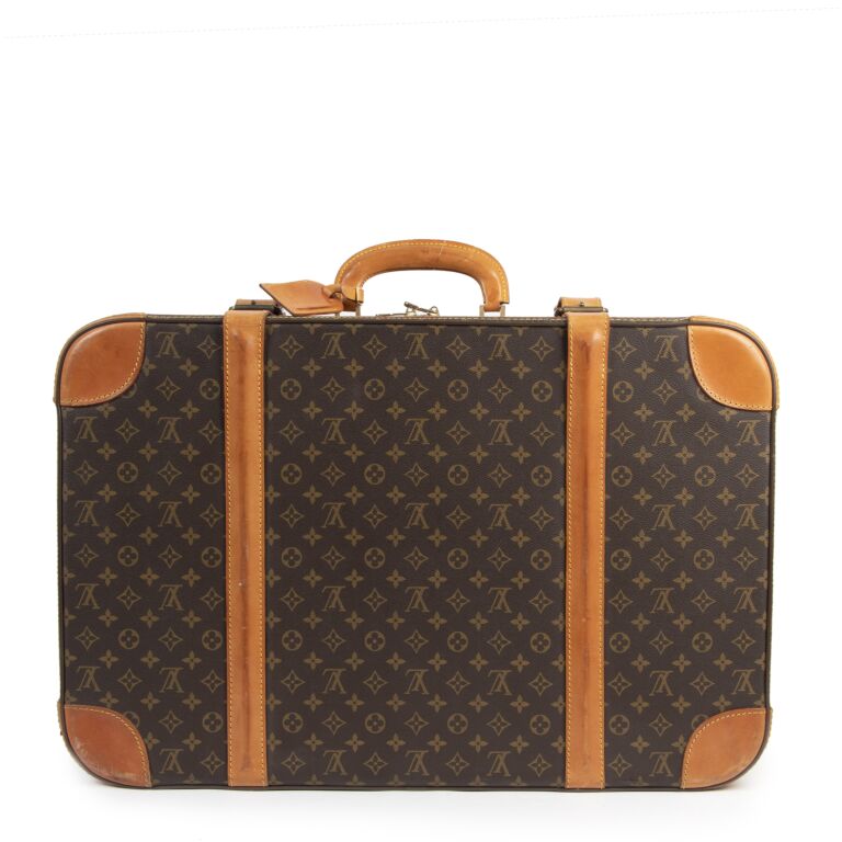 Lot - Louis Vuitton Monogram 'Stratos 70' Suitcase, L: 31 in. (78.7 cm.)