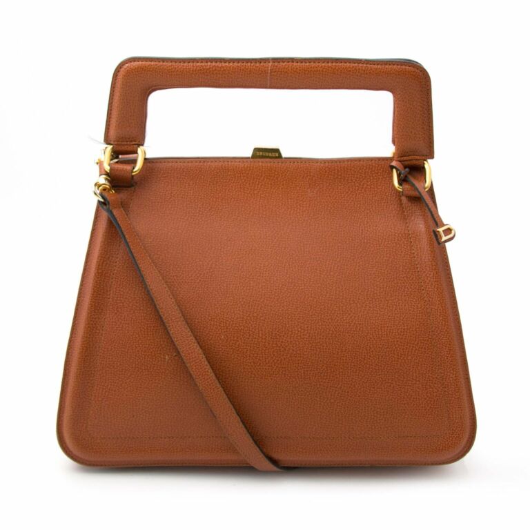 Delvaux Small shoulder bag in camel grained leather.