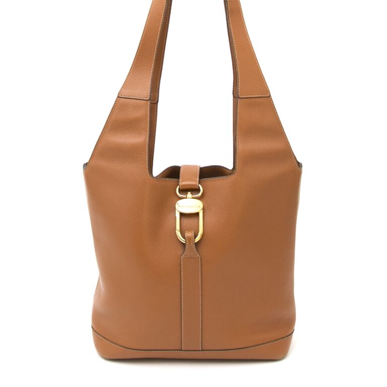 Delvaux Small shoulder bag in camel grained leather.