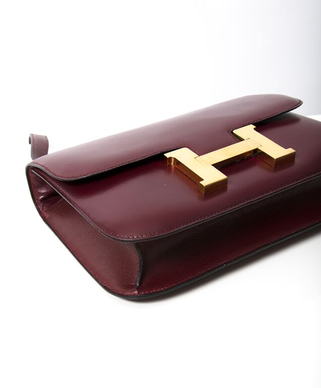 Sold at Auction: A Vintage Hermes Constance Handbag. Burgundy red crocodile  leather. Gilded hardware with letter H clasp. Interior zipped compartment.  In good condition but some slight markings on inner flap. Ref