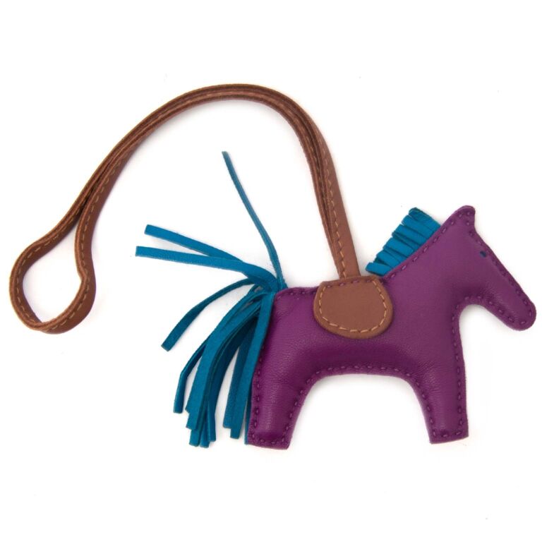 Hermes Kelly bag in Anemone + Rodeo horse charm.