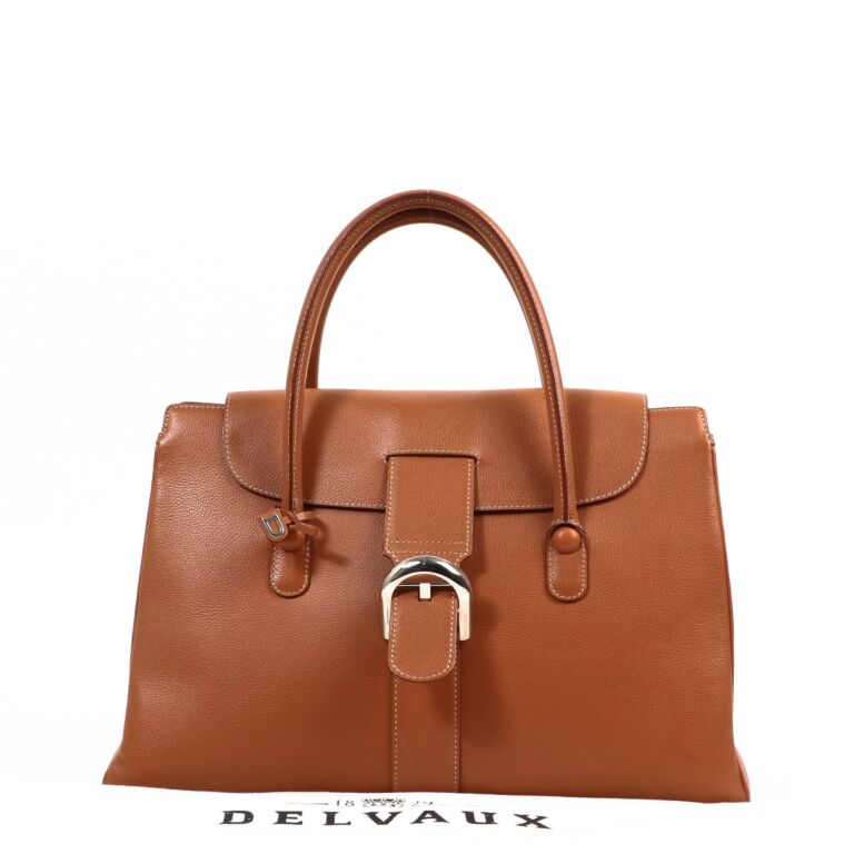 Delvaux Small shoulder bag in camel grained leather.