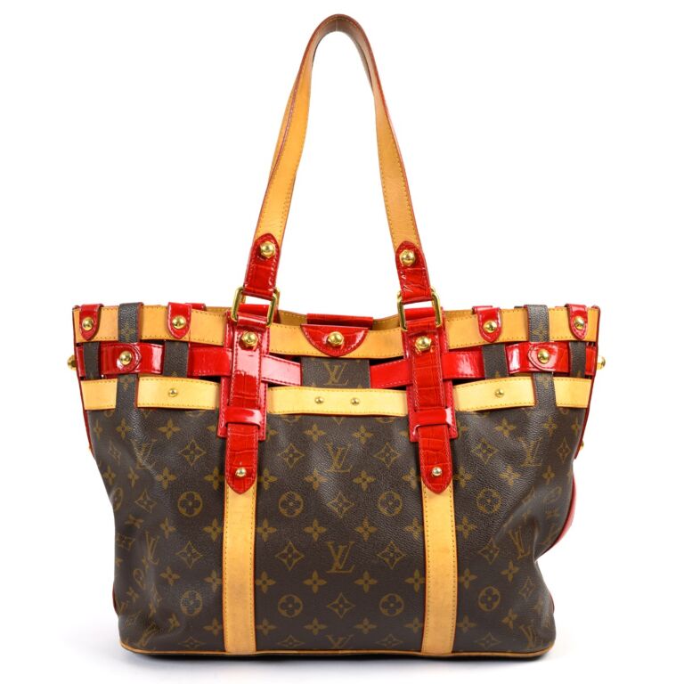 A LOUIS VUITTON RUBIS SALINA PM BAG, with double top handles, natural  leather trim and red patent cr