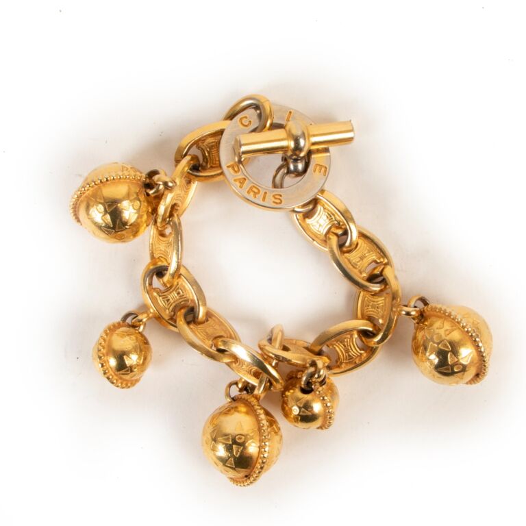 Celine Vintage 1990 Gold tone Triomphe Planisphere Charm Bracelet Labellov Buy and Sell Authentic Luxury