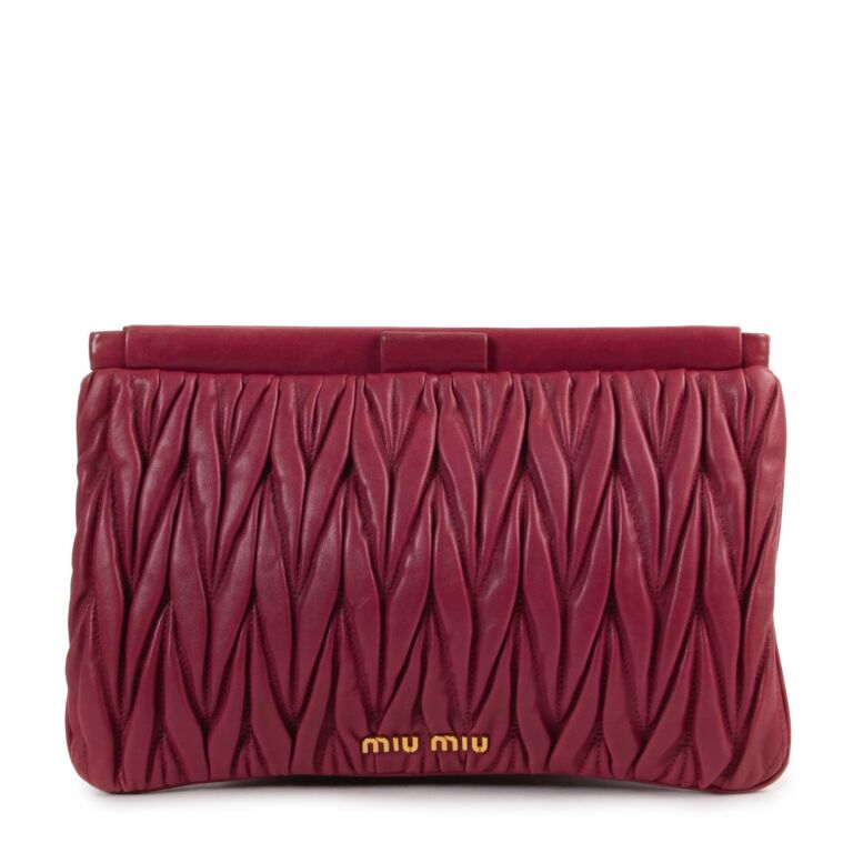 Miu miu clutch sale hot sale