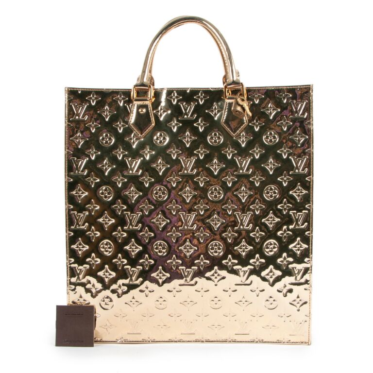 A Louis Vuitton Limited Edition Gold Monogram Miroir Sac Plat Bag, 14.25 x  15 x 4. sold at auction on 26th October