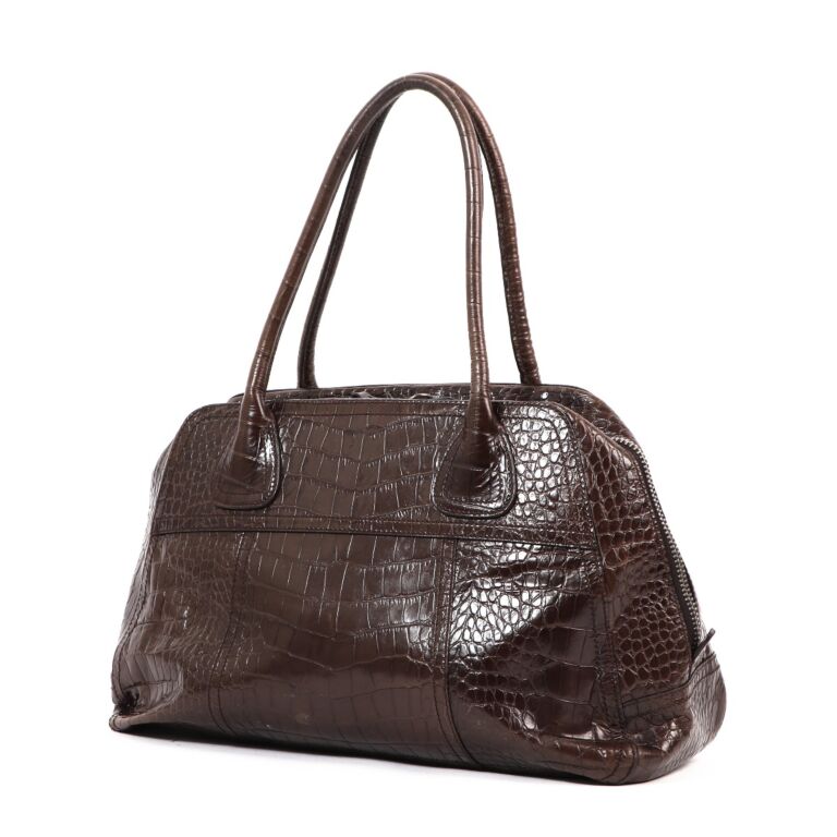 PRADA brown crocodile-printed leather bag. Cm 24.5x37x13…