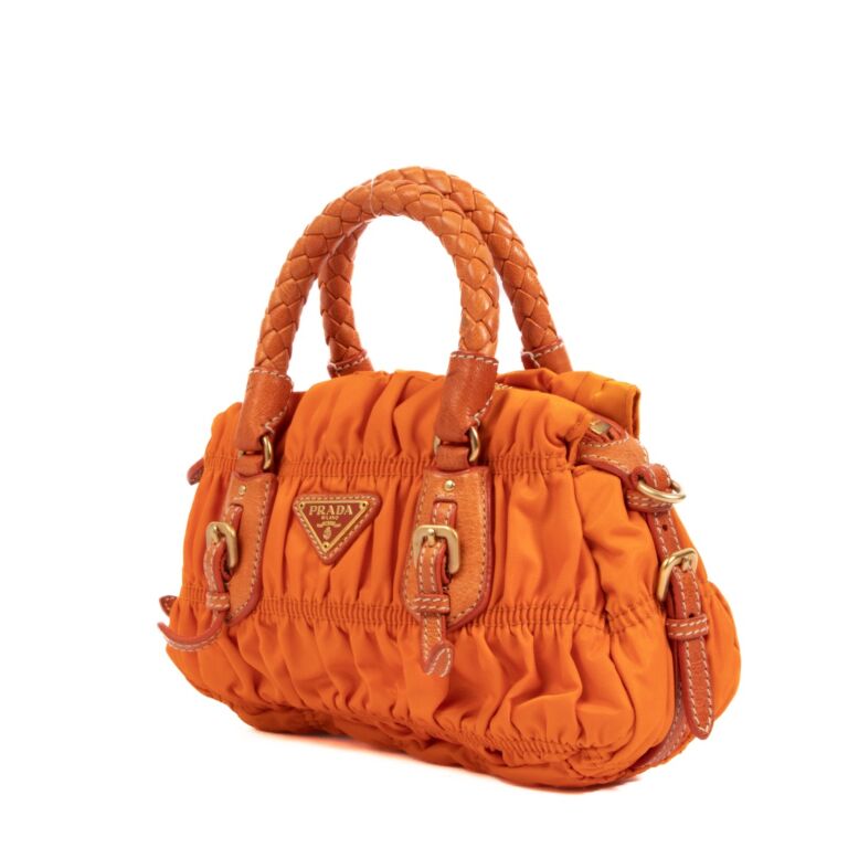 Prada discount orange clutch