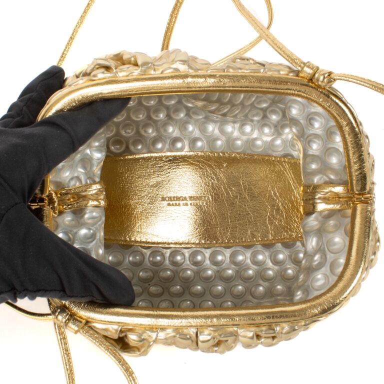 Bottega veneta gold pouch clearance