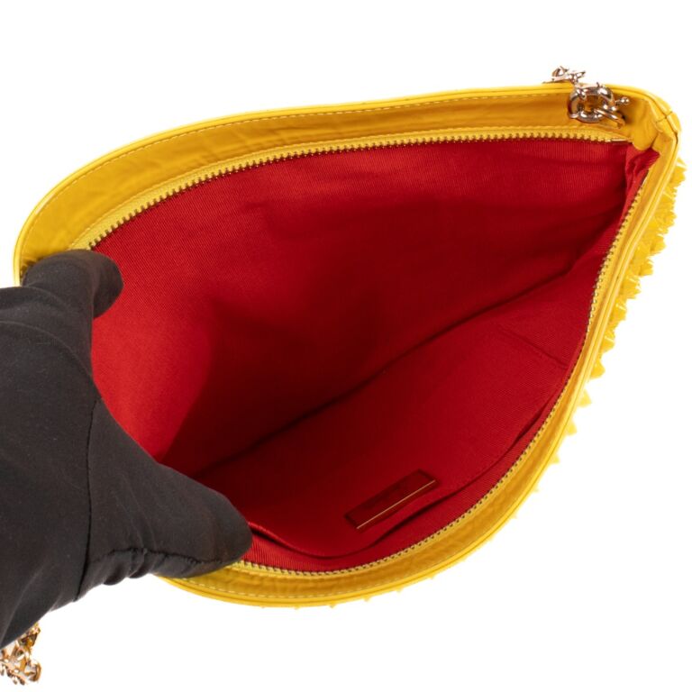 Louboutin studded clutch best sale