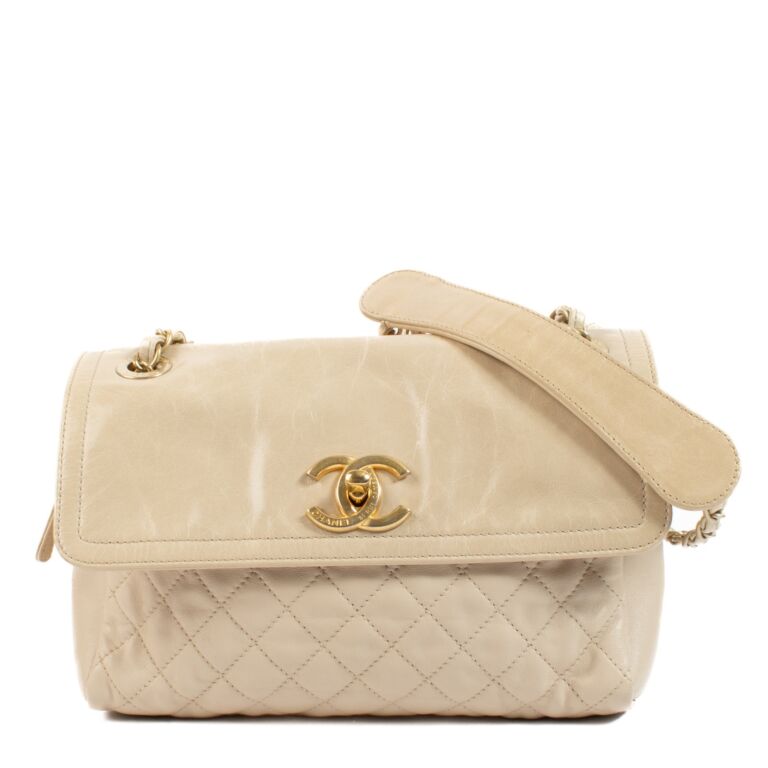 Chanel beige lambskin bag top