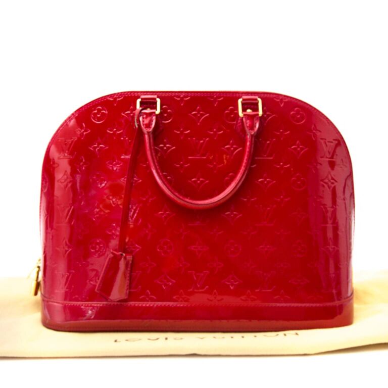 Refinished the leather on my vintage Louis Vuitton Alma bag and hand  painted it with a red-pink that I am in LOVE with. Covered all the stains  and scuffs and looks brand