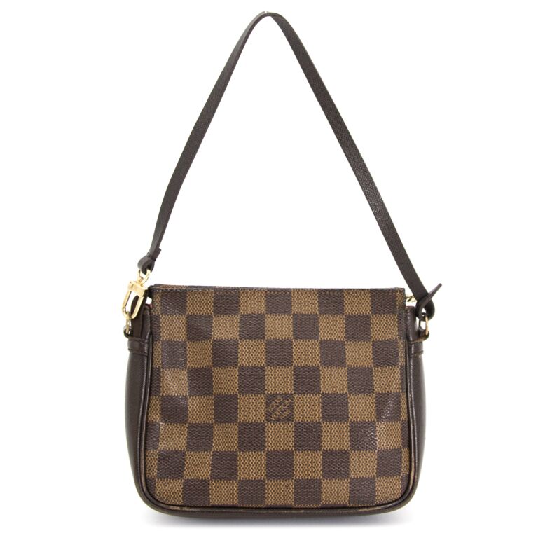 LOUIS VUITTON. Pochette Eva en toile damier ébène et cui…