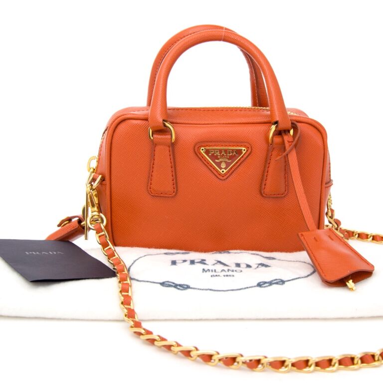 Prada orange clutch sale