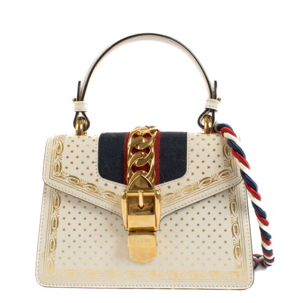 Shop safe online at Labellov in Antwerp, Brussels and Knokke this 100% authentic second hand Gucci Off White Star Print Mini Sylvie Top Handle Bag