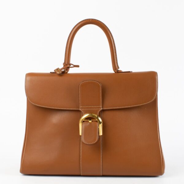 Delvaux Brillant Top Handle Bag in Gold Box Calf leather with gold-tone hardware available at Labellov.com