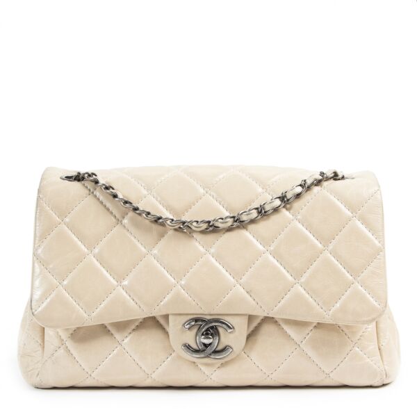 We buy and sell your authentic designer  Chanel Cream Distressed Leather Flap Bag