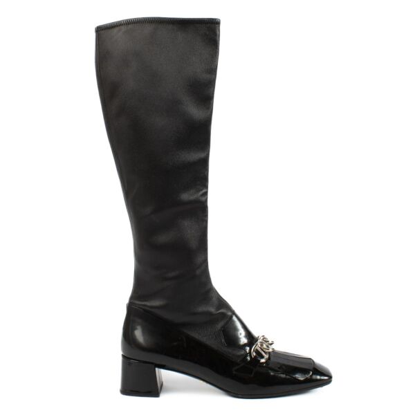 Prada knee-high boots in size 41, crafted from elastic leather. Stylish and timeless. Shop at Labellov.