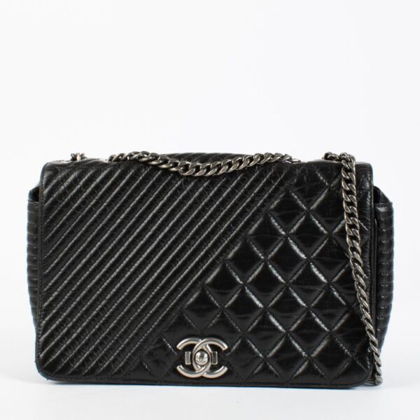 Shop the authentic Chanel Coco Boy Medium Quilted Glazed Calfskin Flap Bag in Noir with ruthenium hardware at Labellov.com.