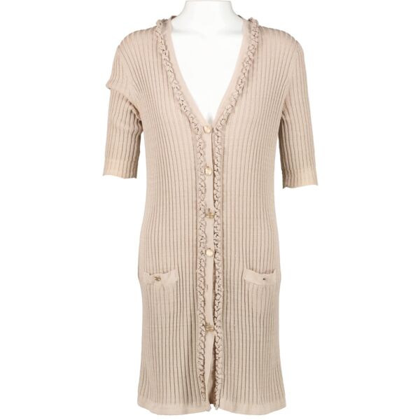 Buy online an authentic second hand Chanel Spring 2009 Beige Cardigan Dress in very good condition at Labellov in Antwerp. 