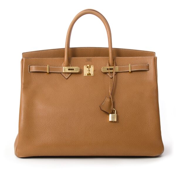 Hermès Birkin Gold 40 Veau Grainé GHW Hermès Birkin bag in Veau Grainé, a durable matte and smooth leather type that keeps its shape. If you like your Birkin bag structured and not relaxed and not slouched, Veau Grainé is your leather!  This Birkin b