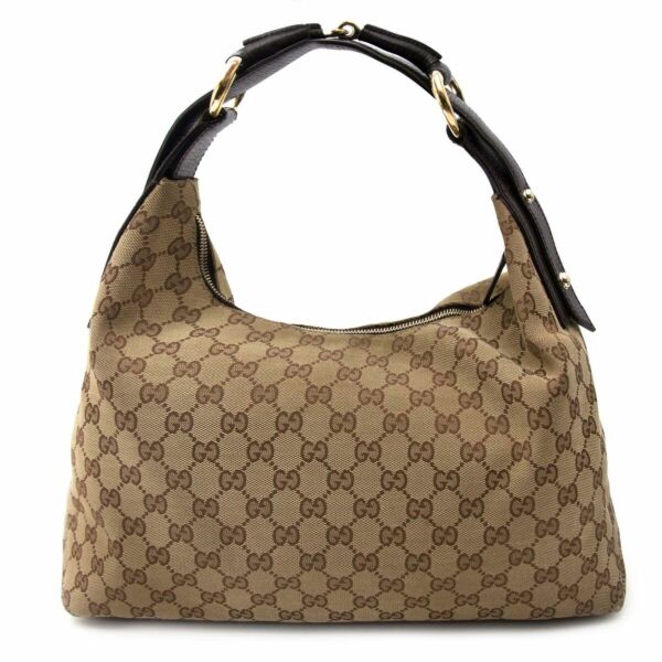 Buy an authentic secondhand Gucci bag in monogram with horse bit handle at the right price at LabelLOV vintage webshop. Safe and secure online shopping.