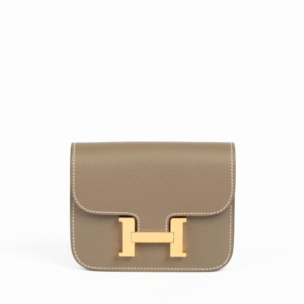 Shop this 100% authentic Hermès Constance Slim Wallet Etoupe Epsom GHW at Labellov.com