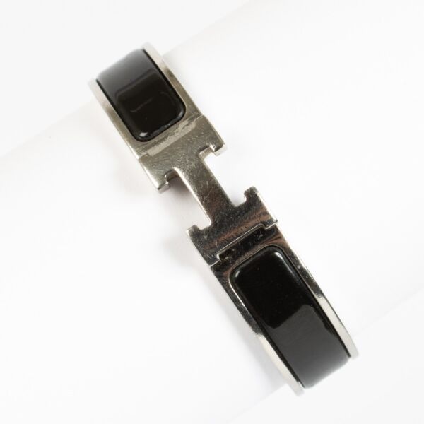 Shop the authentic Hermès Clic H PM Bracelet in black enamel with palladium hardware at Labellov