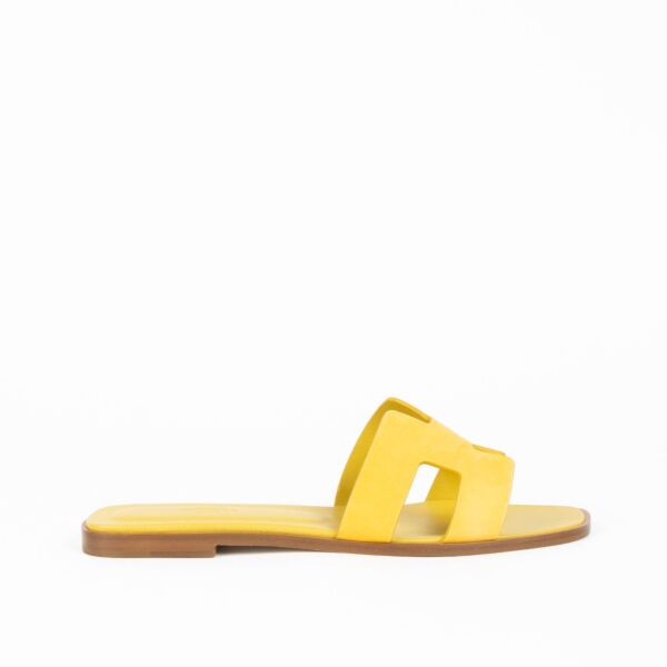 Are you looking for an authentic designer accessory? We buy and sell your preloved and brand new Hermès Yellow Suede Oran Sandals. 