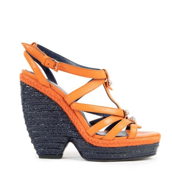 Buy authentic second hand Balenciaga Giant Studded Orange Wedge Heels - size 38 in good condition at Labellov in Antwerp.