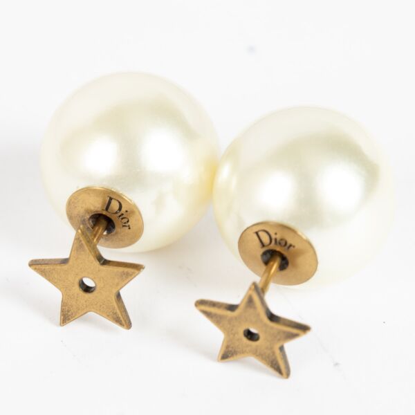 Dior gold-tone star and pearl earrings with Dior logo engraving at Labellov.com.