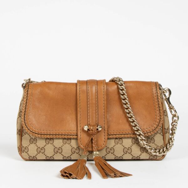 Authentic pre-loved Gucci GG Canvas Marrakech Chain Clutch on Labellov.com
