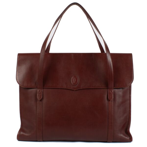 Shop safe online at Labellov in Antwerp, Brussels and Knokke this 100% authentic second hand Cartier Burgundy Vintage Tote Bag