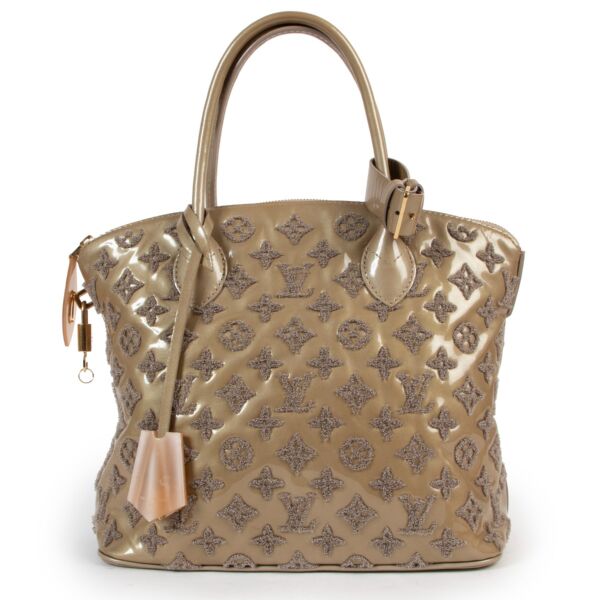 Shop authentic second hand designer vintage Louis Vuitton Limited Edition Beige Monogram Fascination Lockit Bag at Labellov