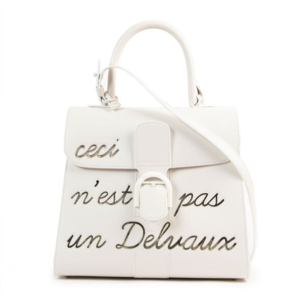 Buy online an authentic second hand Delvaux Brillant MM L'Humour ( Ceci n'est pas un Delvaux) Limited Edition in very good condition at Labellov in Antwerp. 
