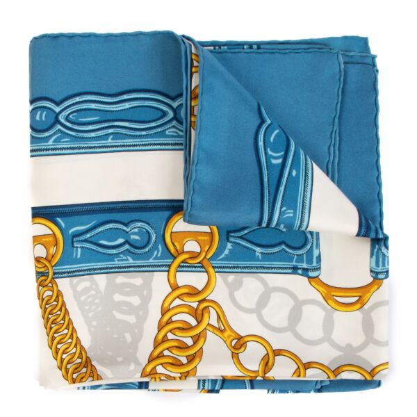 Shop safe online at Labellov in Antwerp, Brussels and Knokke this 100% authentic second hand Hermès Light Blue Maillons Silk Scarf