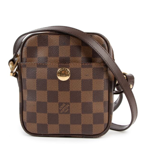 Buy online an authentic second hand Louis Vuitton Damier Ebene Rift Crossbody in very good condition at labellov in Antwerp. 
