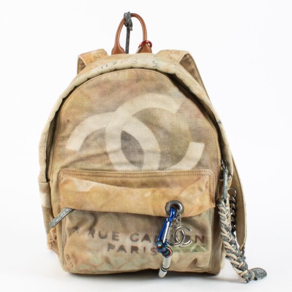 Chanel Beige Graffiti Backpack from 2014 with distressed canvas and rope accents at Labellov.com