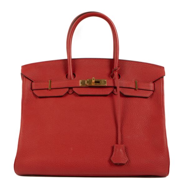 Authentic Hermès allure awaits with the Birkin 35 Rouge Grenat Togo GHW - a symbol of prestige and style.