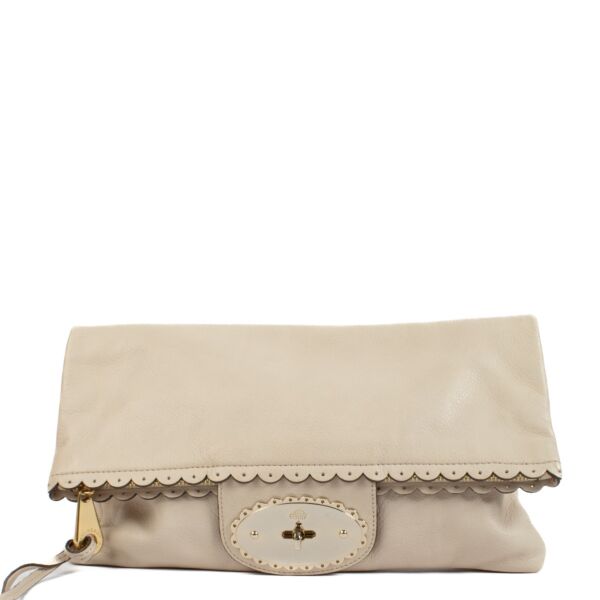 Mulberry clutch with gold hardware, featuring two compartments for easy organization, perfect for an evening out. Shop now on Labellov.com. 
