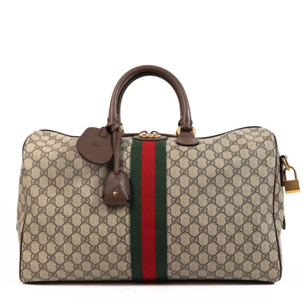Buy an authentic second hand Gucci Savoy Medium GG Supreme Ophidia Duffle Bag in very good condition at Labellov 