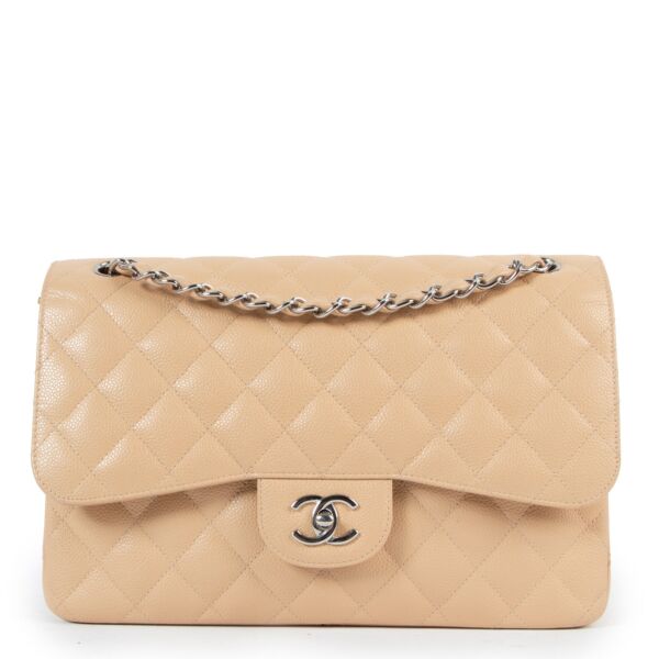 Chanel Beige Caviar Leather Jumbo Classic Flap Bag for the best price at Labellov secondhand luxury. We buy and sell your authentic designer bags for the best price at Labellov.