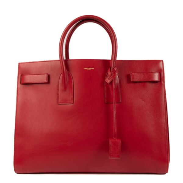 Shop safe online at Labellov in Antwerp, Brussels and Knokke this 100% authentic second hand Saint Laurent Red Large Sac de Jour Bag. Veilig online tweedehands authentieke Saint Laurent Red Large Sac de Jour handtas kopen bij Labellov. 