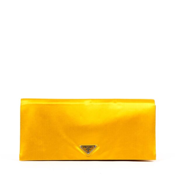 Buy an authentic second-hand Prada Silk Viscose Satin Yellow Clutch in good condition at Labellov in Antwerp.
